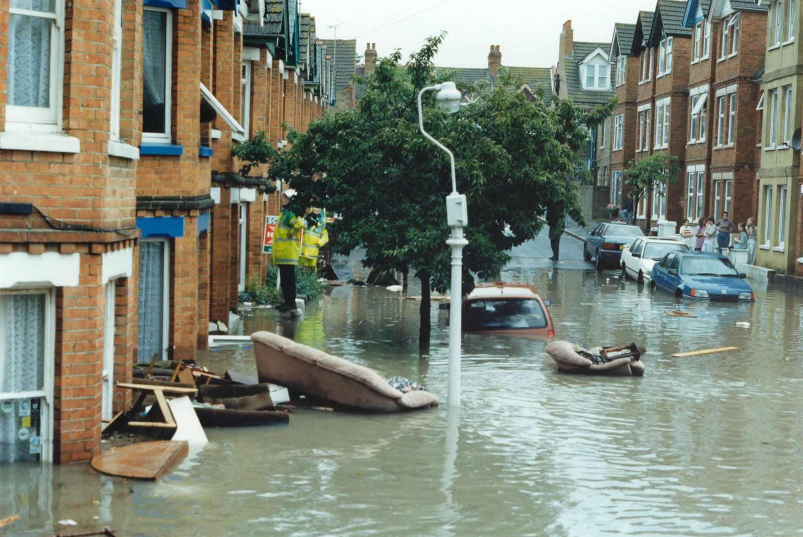 Cars and furniture in the flood waters in 1996. Picture: Max Hess