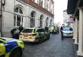 Four police cars and van in town centre