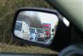 Car on its roof causing motorway delays