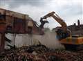 Remains of warehouse demolished following blaze