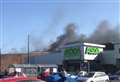 Explosions heard as car destroyed in blaze at shopping centre