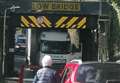 Lorry jammed under bridge