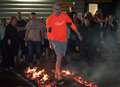 Dozens hotfoot it across coals for hospice fundraiser 