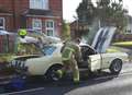 Fire crews battle classic car blaze