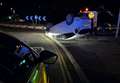 Car flips onto roof near popular McDonald's