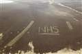 NHS letters cut into heather on moor to show support for health workers