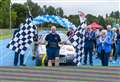 Man pulls a car over half marathon distance