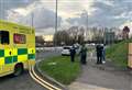 Car overturns in crash outside shopping centre