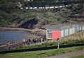 Woman rescued from bottom of cliffs