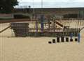 Boy gets stuck head first in sand at park 