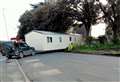 Stuck caravan causes chaos as bus passengers get off and walk