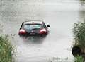 Car sunk in lake at beauty spot