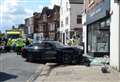 Traffic chaos after car crashes into shop