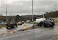 Car hits lamppost at busy roundabout