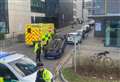 Car flips outside university