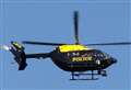 Police helicopter in search for suspect over village