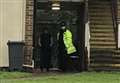 Police guarding block of flats