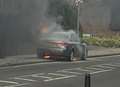 Car fire closes road