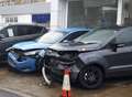 Car smashes into showroom forecourt