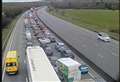 Motorway traffic stopped as car overturns