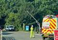 A-road shut in both directions after car hits electricity pole