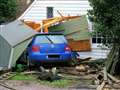 car crashes into house