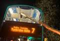 Huge branch pierces window and roof of double-decker bus