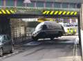 Cherry picker stuck under bridge