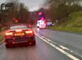 Cars crash on busy road