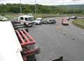 Two hurt as apple lorry overturns