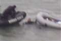 Boats land on beach in bad weather