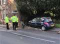 Policeman crashes car into city house