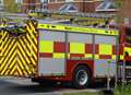 Woman rescued from flat fire