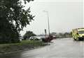 Car flips onto roof by roundabout