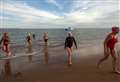 Historic swim to shifting sands