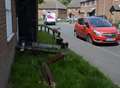 Dustcart reverses into house