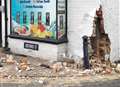 Two men arrested after car crashes into shop