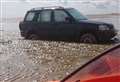 Volunteer's car stranded on beach while searching for Lucas