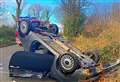 Woman taken to hospital after car overturns