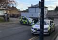 Multiple police vehicles swoop on town road