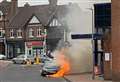 Car catches fire outside station