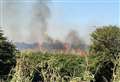 Crews tackle corn field blazes