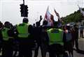 Four charged after immigration march