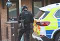 Two arrests after armed police swoop on village