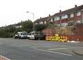 Workmen dismantle unstable wall