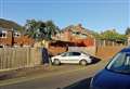 Car smashes through garden fence