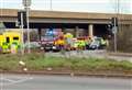 Two taken to hospital after car flips on its side at busy roundabout