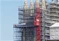 Woman climbs to top of cathedral