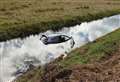 Car leaves road and ends up in dyke