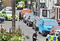 Armed police descend on residential street